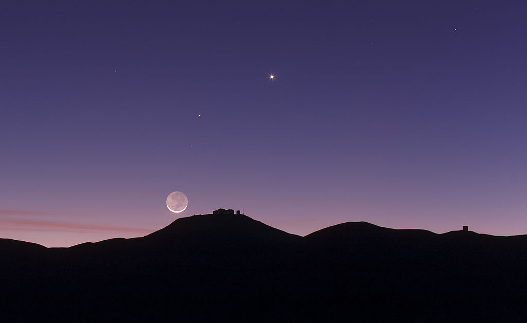 Crescent Moon with Earthshine setting over ESO's Paranal Observatory in Chile (credit:- ESO)
